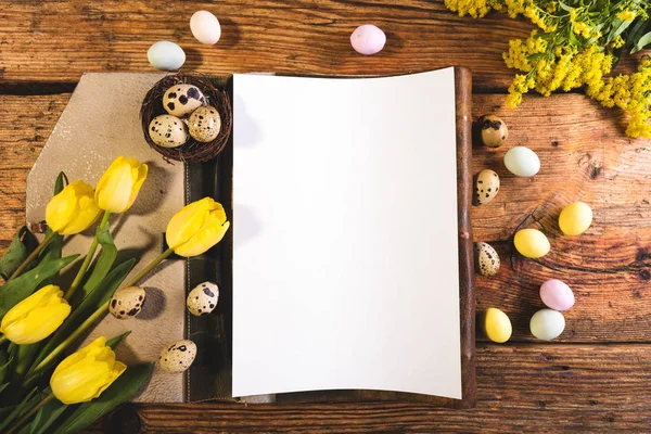 Easter menu on a wooden table decorated in eggs and fresh flower