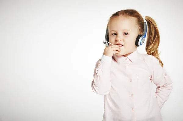 Young cheerful female customer support operator with headset and — Stock Photo, Image