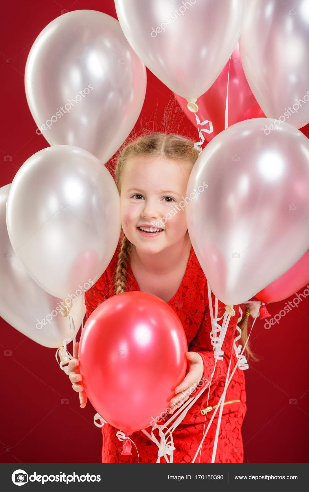 Party balloons in red, blond girl plays with. — Stock Photo © Jaromatik