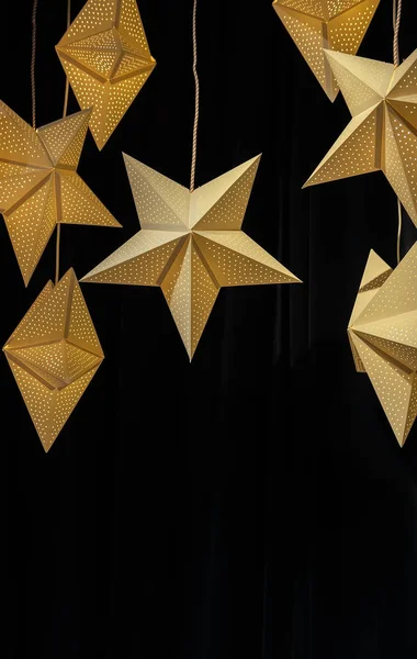 Yellow-gold stars glow on a dark black fabric background