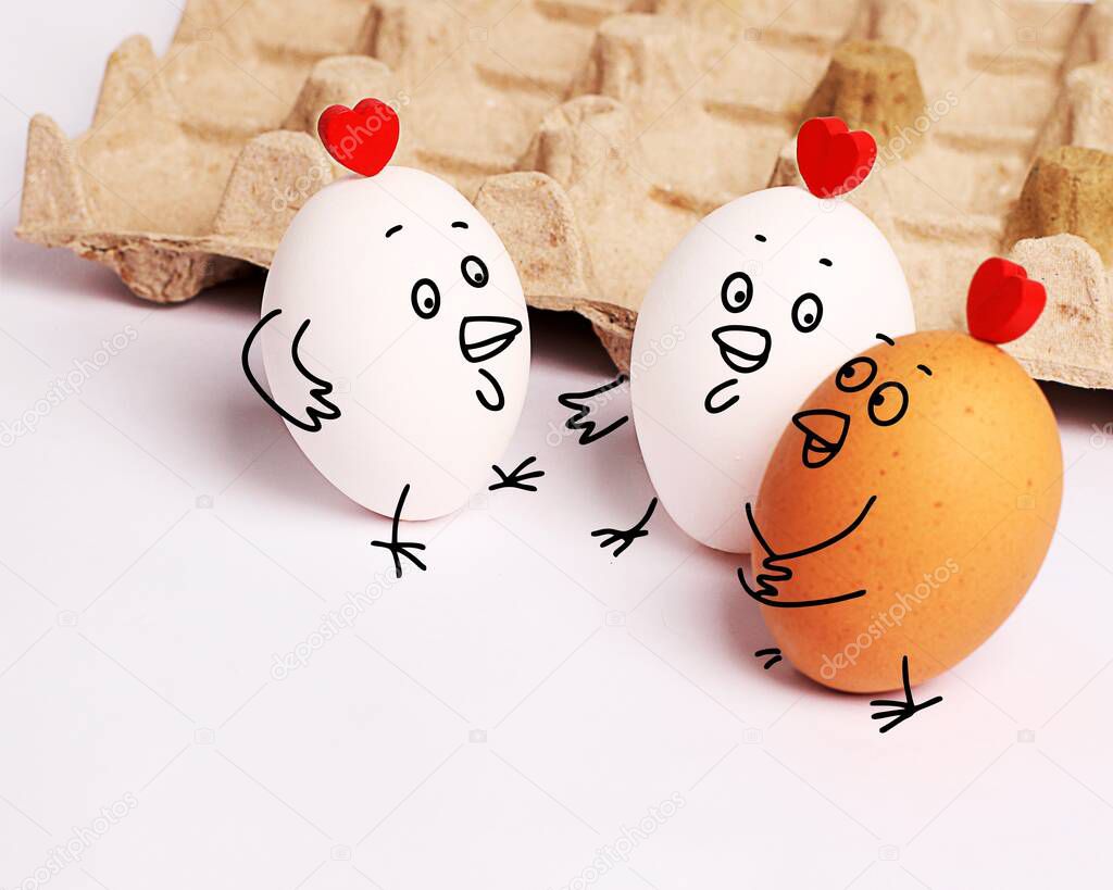 Three funny white eggs with painted faces. Girlfriends - hen chatter, gossip. Easter. Eggs with funny faces. Rest with friends. communication and relaxation together.