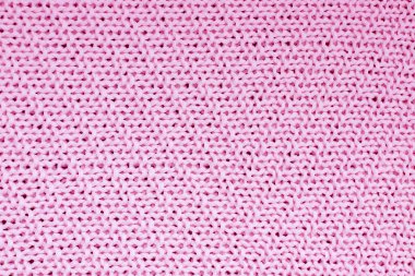 Pembe örülü battaniye dokusu. Soyut arkaplan. Büyük döngüler. Doğal pamuk iplikleri. Yukarıdan görünüşü
