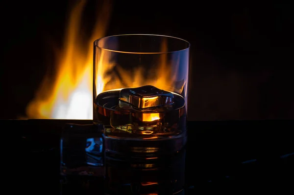 whiskey ice fire on a black background