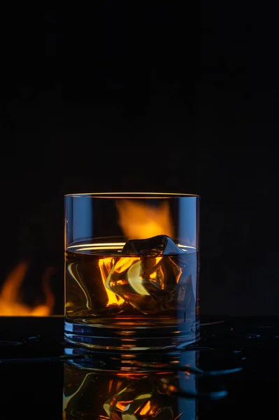 whiskey ice fire on a black background10