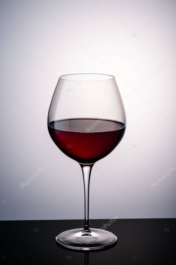 red wine in a wine glass on the background11