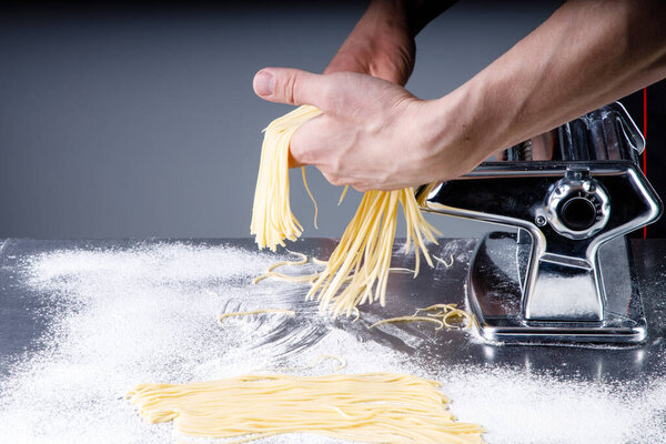 chef making noodles for a restaurant in a kitchen5