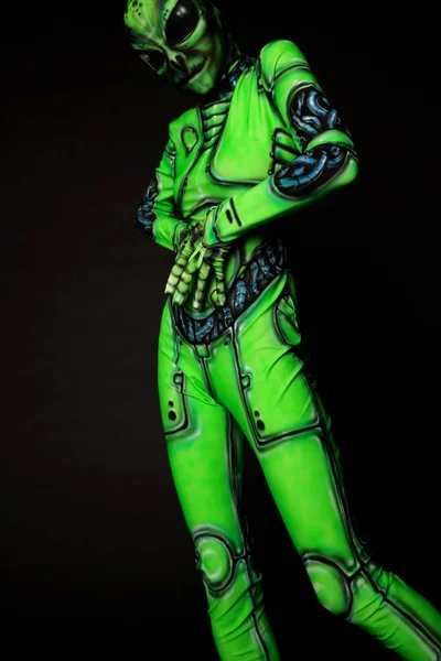 model in suit of green alien