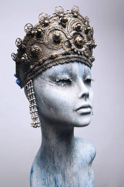 Woman in creative bronze crown