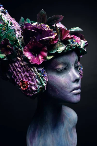 Mannequin in head wear with flowers