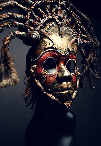 Creative african mask, dark studio background - Stock Image - Everypixel