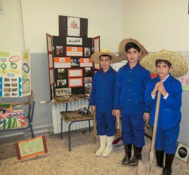 Rasht, Gilan, Iran, 05 05 2019. Agricultural education in elementary schools. Kids in school uniform. Science bell at boys' school.