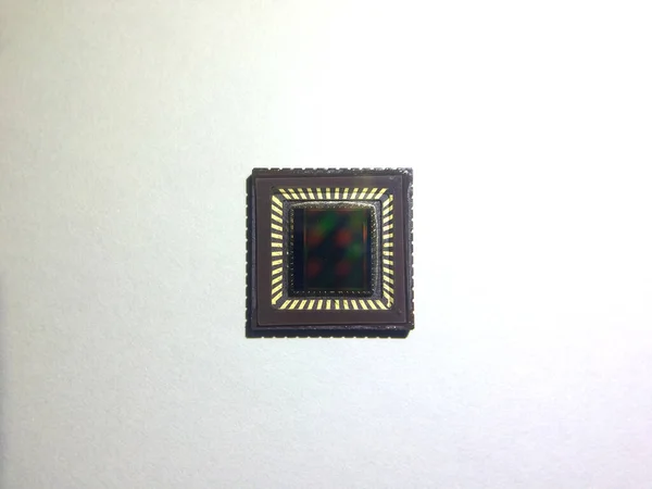 A CCD image sensor or a CMOS image sensor on white background.