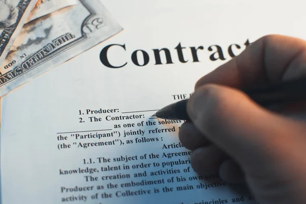 In the hand grip, fills in the contract between the producer and partner