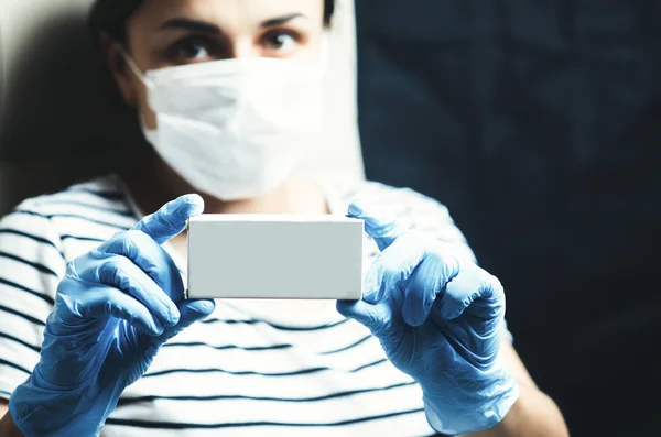 girl doctor with gloves, an empty pack is medicine