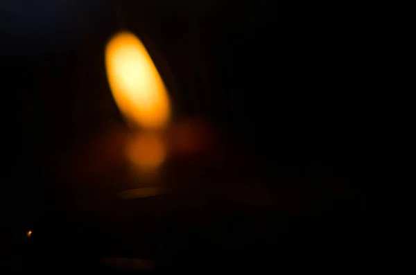 Burning candle in the dark — Stock Photo, Image