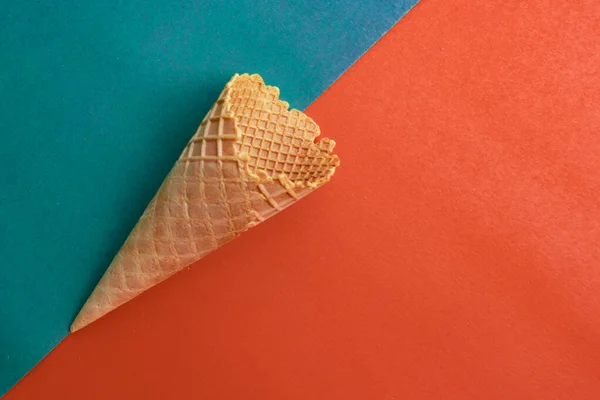 waffle cone on orange and green background,