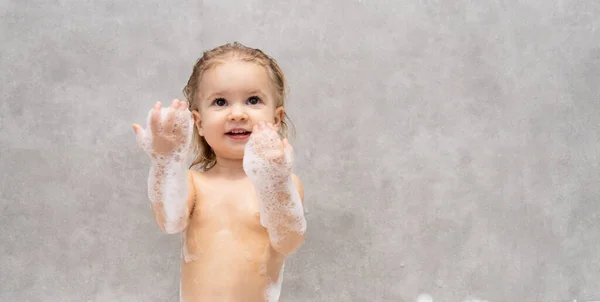 Portrait of baby washing and playing — Stock Photo, Image