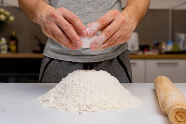 Closeup of mans hands making dough