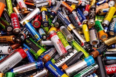 A pile of batteries of different brands