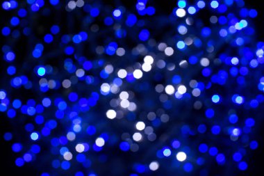 Bokeh 'te parıldayan yıldızlar. Noel arkaplanı