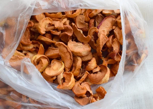 dried apples in a plastic bag. slices of dried apples for compote.
