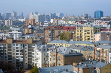 View of the city from a height. Panorama of the city in the fall, multi-storey buildings of different heights.