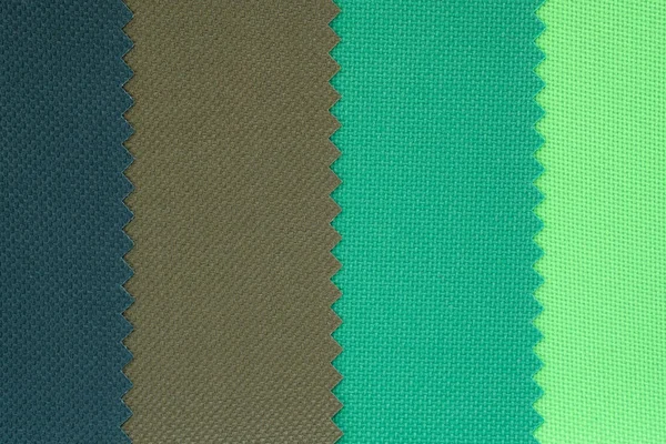 Samples of fabrics in pastel shades. Blue, green, brown piece of fabric with texture. Lightweight fabric made of synthetic fibres (nylon or polyester) of a certain structure with a special coating.