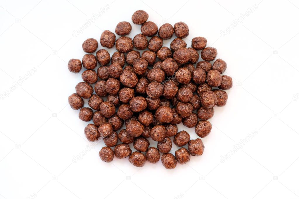 Dry breakfast - chocolate balls. Corn balls with chocolate top view.