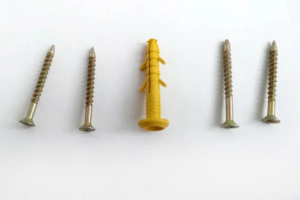 Yellow Plastic Dowels Metal Screws White Background Construction Material Anchor — Stock Photo, Image