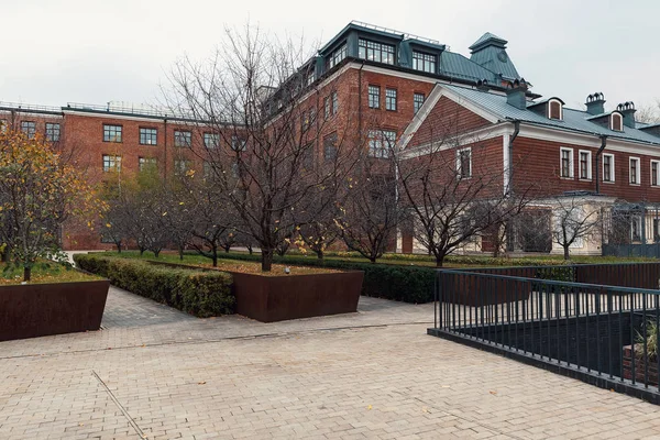 Modern urban architecture. Reconstruction of buildings of the old factory complex with brick walls. At the present time in the premises of the former factory are modern offices of companies