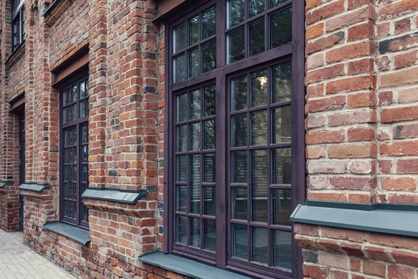 Modern urban architecture. Reconstruction of buildings of the old factory complex with brick walls. At the present time in the premises of the former factory are modern offices of companies