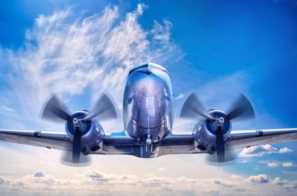 Airplane over the clouds — Stock Photo, Image