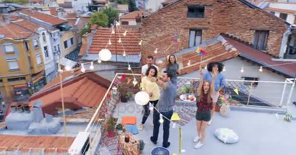Drone Flight Over Rooftop Diverse Young Party People Cheerful Partying Jumping Hipster Culture Urban Relaxation Concept At Sunset — Stock Video