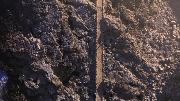 Aerial Top View Of Man Walking On Narrow Path Through Sea Shore Cliffs At Sunset Sunrise Looking For Direction In Life Difficult Road Decision Concept — 비디오