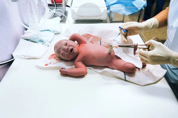 Newborn in nursery after childbirth.