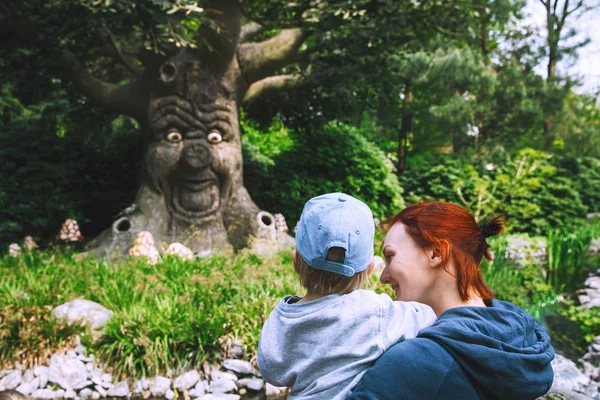 Family is having fun at amusement park Efteling, Netherlands.