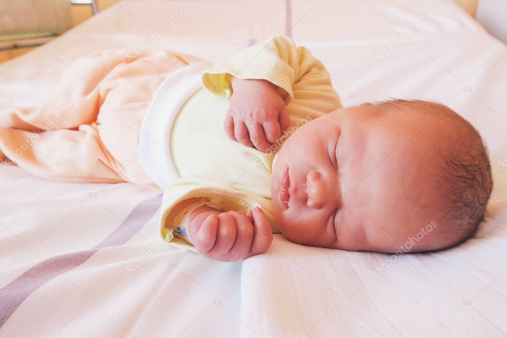 Newborn baby first days of life after childbirth.