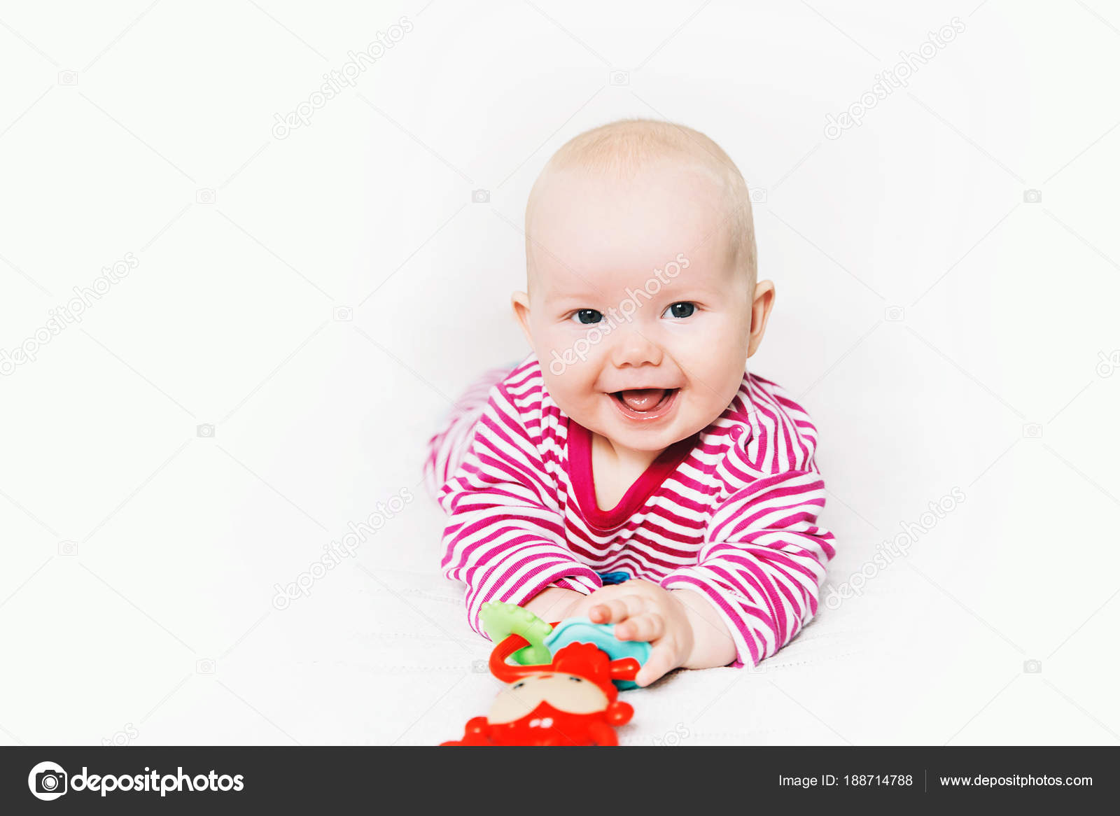 Smiling cutest baby playing with colorful toys — Stock Photo