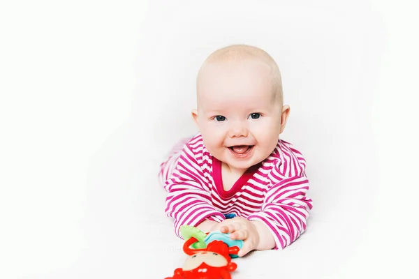 Sorrindo bebê mais bonito brincando com brinquedos coloridos — Fotografia de Stock