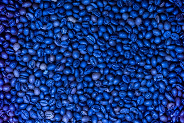 Background of coffee beans. Top view. Classic blue Color of the year 2020. — Stock Photo, Image