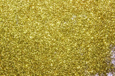 Güzel altın parıltılı bir kompozisyon. Altın parıltılarının arka planı ve dokusu. Lüks altın parıltılı ışıltılı doku arka planı