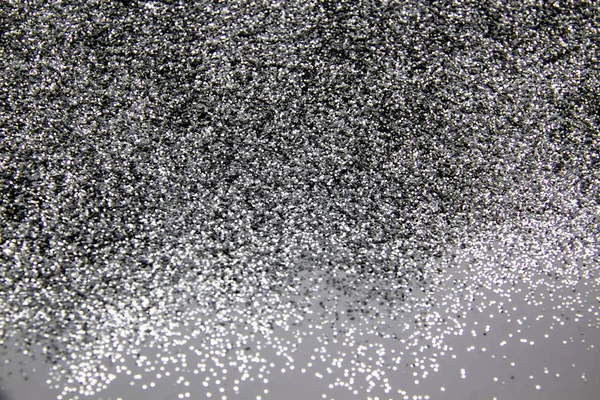 A composition with  beautiful silver glitter. Background and texture of silver glitter. Luxury silver glitter sparkle shining texture background