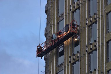 high-rise work on the construction of a multi-storey building