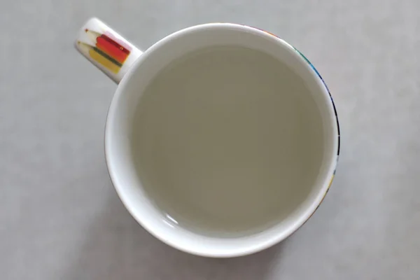 white cup with water - top view