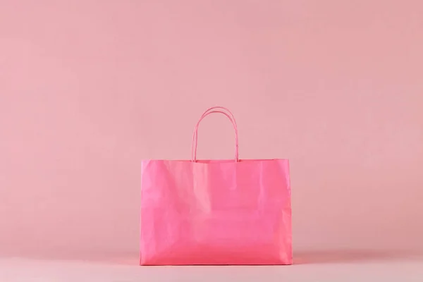 Pink shopping bag on pink background — Stock Photo, Image