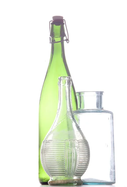 Glasse bottles with green and transparent material — Stock Photo, Image