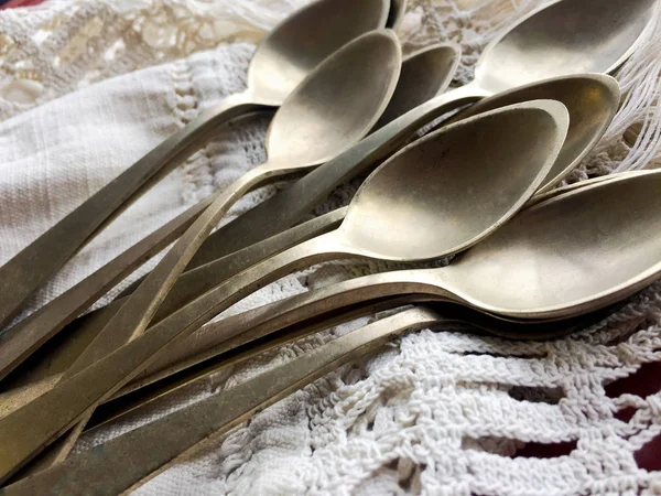 Old spoons on canvas — Stock Photo, Image