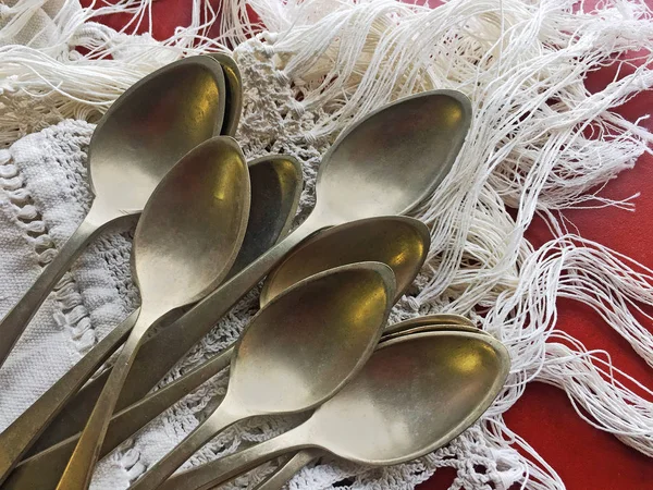 Old spoons on canvas — Stock Photo, Image