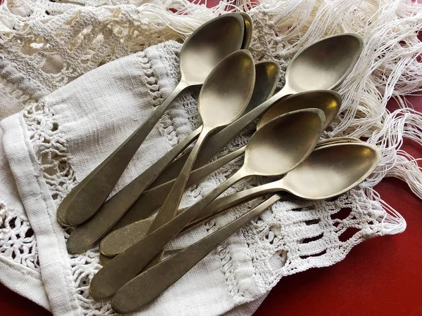 Old spoons on canvas — Stock Photo, Image