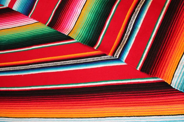 Mexico Mexican traditional cinco de mayo rug poncho fiesta background with stripes — Stock Photo, Image
